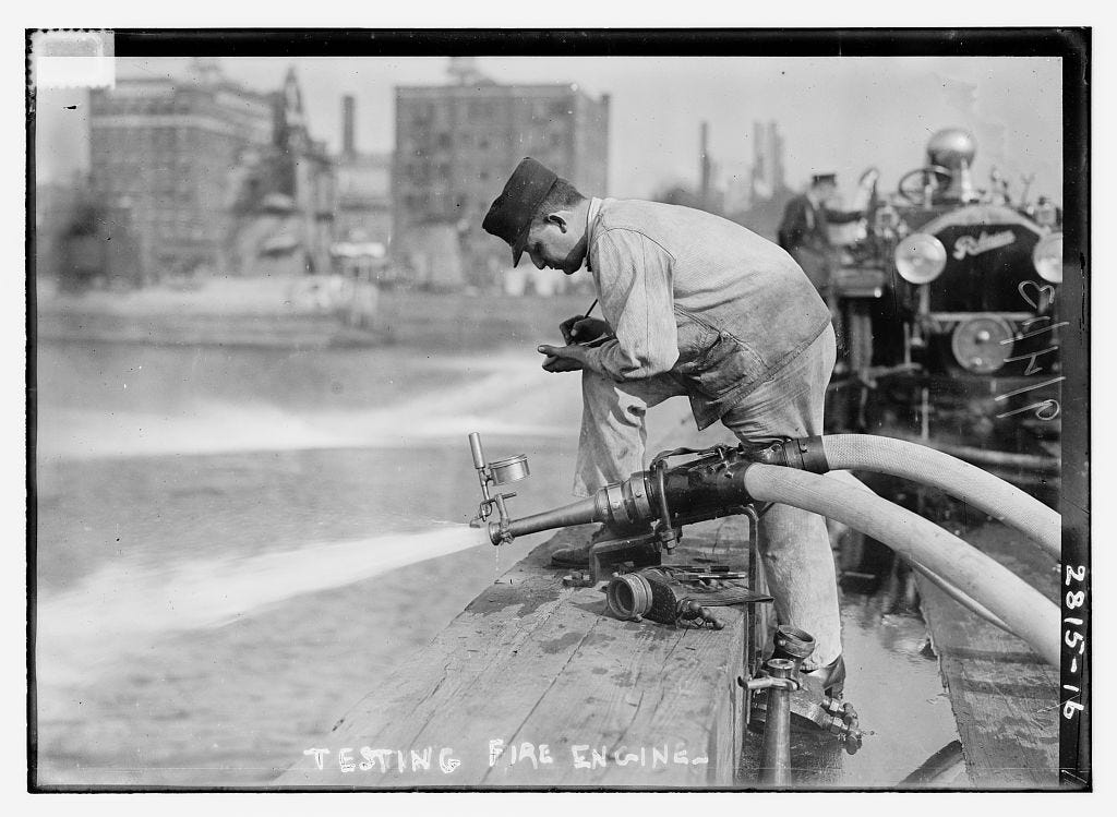 From Library of Congress: "Photo shows competition of motor pumper engines held by the International Association of Fire Engineers, New York City, Sept. 3, 1913. Pumper engines drew water from the Hudson River." September 3, 1913